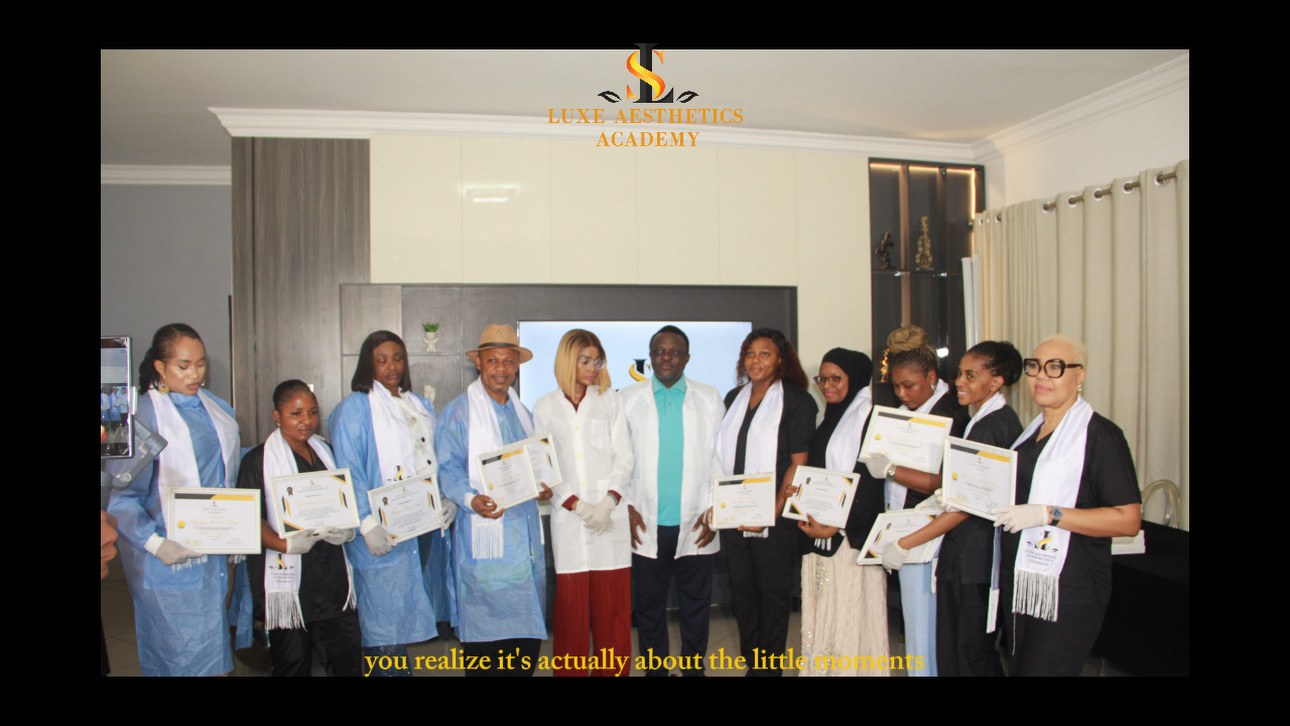 Luxe Aesthetics Academy students holding certificates